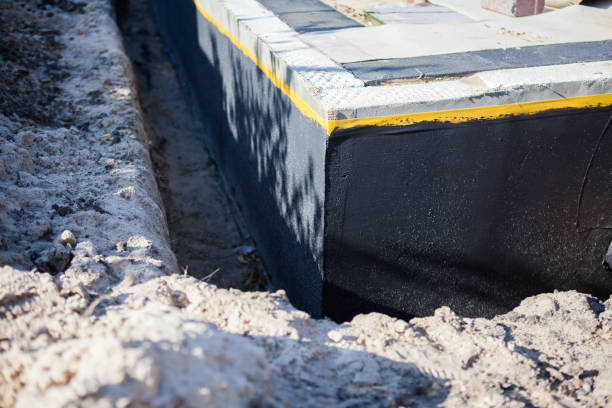Professional Exterior Waterproofing technician working in Baltimore, MD